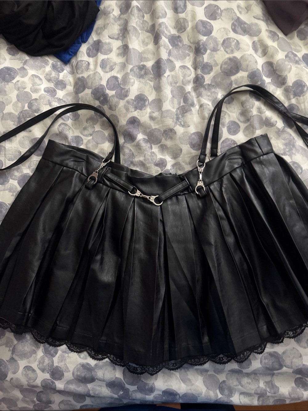 Black Faux Leather Pleated Mini Skirt with Lace Hem and Chain Accent